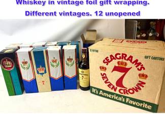 Lot 1169 12 fifths of Seagrams 7 Crown Whiskey in vintage foil gift wrapping. Different vintages. 12 unopened