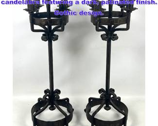 Lot 1125 Pair of matching wrought iron candelabra featuring a dark, patinated finish. Gothic design. 