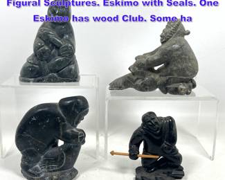 Lot 1106 4pc Carved Stone Eskimo Art Figural Sculptures. Eskimo with Seals. One Eskimo has wood Club. Some ha