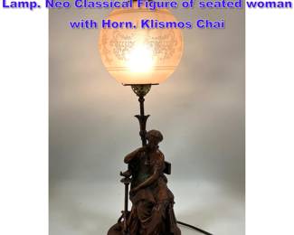 Lot 973 Electrified Banquet Table Figural Lamp. Neo Classical Figure of seated woman with Horn. Klismos Chai