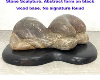 Lot 835 Large Modernist Organic Carved Stone Sculpture. Abstract form on black wood base. No signature found
