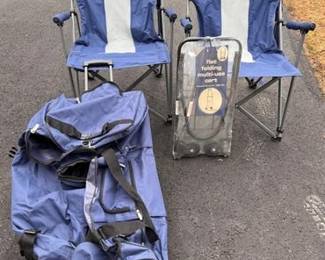 Pair of folding camp chairs and a rolling duffle bag