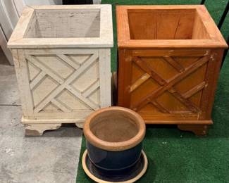 Wooden planter boxes and a ceramic planter with saucer