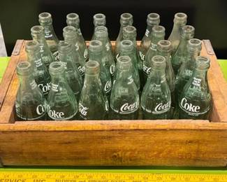 Vintage wooden Coca-Cola crate and bottles