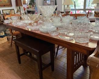 Dining table, piano bench, lots of glassware