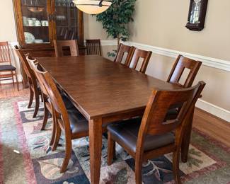 Klaussner Dining Table and 8 Chairs- $650- 96 inches long (includes a 24 inch leaf) , 44 wide, 30 tall
