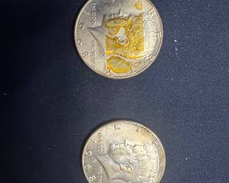 Two John F. Kennedy Half Dollar Coins - One with Damage/Alteration