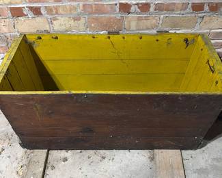 Old trunk with mustard colored paint