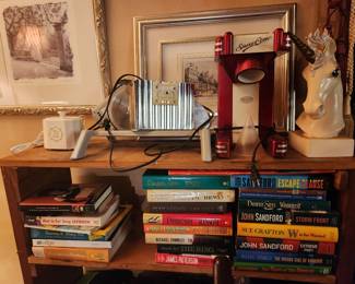 jewelry cleaner, electric meat slicer, snow cone machine, paintings, books, shelving