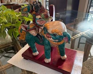 Chinese Polychrome Ceramic Figure of a Warrior Riding a Foo Dog