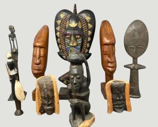 2149Collection of Carved Wood and Metal Sculptures Featuring Mask and Figural Forms 9 Pieces
