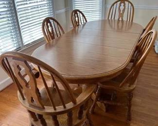 70 inch long with one leaf, each leaf is 11.5 inches; 13 inches tall 40 inches wide - chairs are 39 inches tall. does come with table cover in separate box.