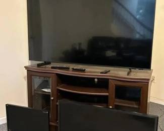 Large Samsung 55” Smart LED TV bundled with additional televisions and a corner entertainment cabinet perfect for a living room, basement media area, or guest space. Included in This Lot Samsung 55” Smart TV Model: UN55AU8000F Manufactured: September 2021 LED Smart TV with remote included. Samsung 32” LED TV Model: UN32J5205AF Manufactured: October 2015 Remote included. ViewSonic 19” LCD Monitor Model: VA1938wa-LED Manufactured: August 2012 Corner Entertainment Cabinet / TV Stand Dark wood finish with glass cabinet doors and interior shelving for media components, gaming consoles, or streaming devices.