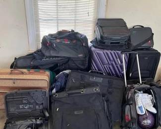 Travel…Back In Time Wonderful lot of vintage suitcases, travel bags, accompanying a camcorder and bowling ball with accessories