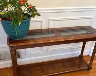 Beautiful Wood Sofa Table With Brass Accents And House Plant 50 inches long 15 inches wide 27 inches tall includes house plant that is a sun patient