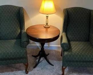 Chair is 42 inches high 31 1/2 inches wide and 28 inches deep Table is 29 inches high and 26 inches round with brass claw feet.