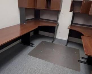 Add a touch of retro-industrial style to your office with this two-piece furniture lot featuring a wood-grain finish and clean lines. This lot includes: Sled-Base Writing Desk: A streamlined desk featuring a rich wood-grain laminate top and a modern, silver-tone metal sled-base frame. Perfect for a laptop station or a creative workspace. 12-Section Wooden Cubby Organizer: A versatile, open-front storage unit with twelve equal-sized cubbies. Ideal for sorting mail, organizing office supplies, or displaying a collection.