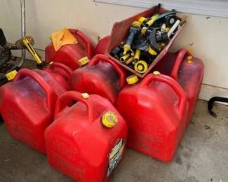 Eight Gas Cans And Accessories