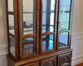 Beautiful Solid Wood China Cabinet With Lights 51 inches long 16 inches deep 76 inches tall China cabinet - top does remove from the base, lights up. Will need help for moving.