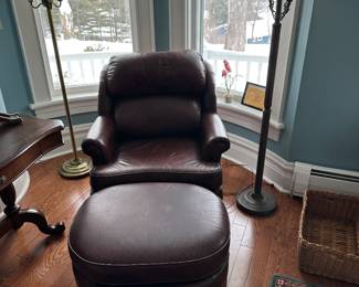 Leather chair and ottoman; slight damage to surface