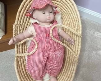 Vintage Baby Doll in Red Gingham Romper and Bonnet in Wicker Bassinet