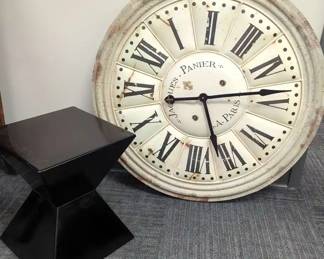 Large Clock And Black Side Table