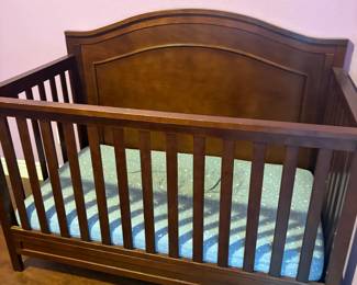 Wooden crib with bed