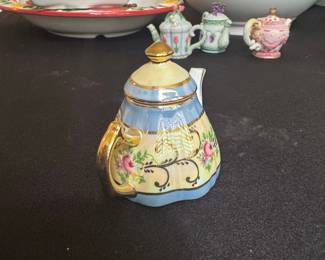 D.N. & E.I. Porcelain Teapot Figurine