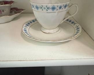 Chinese Porcelain Teacup and Saucer Set with Blue Floral Motif
