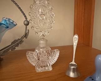 Crystal Angel Perfume Bottle with Ornate Starburst Stopper, likely Irice