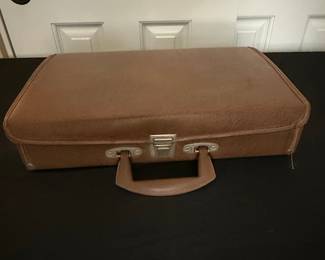 Vintage Suitcase with Assorted Cassette Tapes