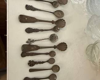Assorted Antique Silver-Plated Serving Utensils and Spoons, including Shell and Ornate Patterns