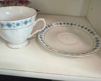 Chinese Porcelain Teacup and Saucer Set with Blue Floral Motif