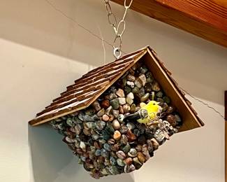 Many stone bird houses all sizes