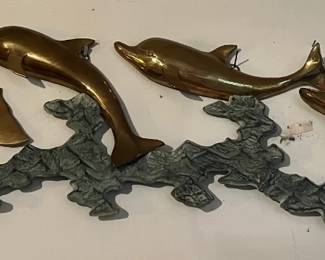 Brass swimming dolphins