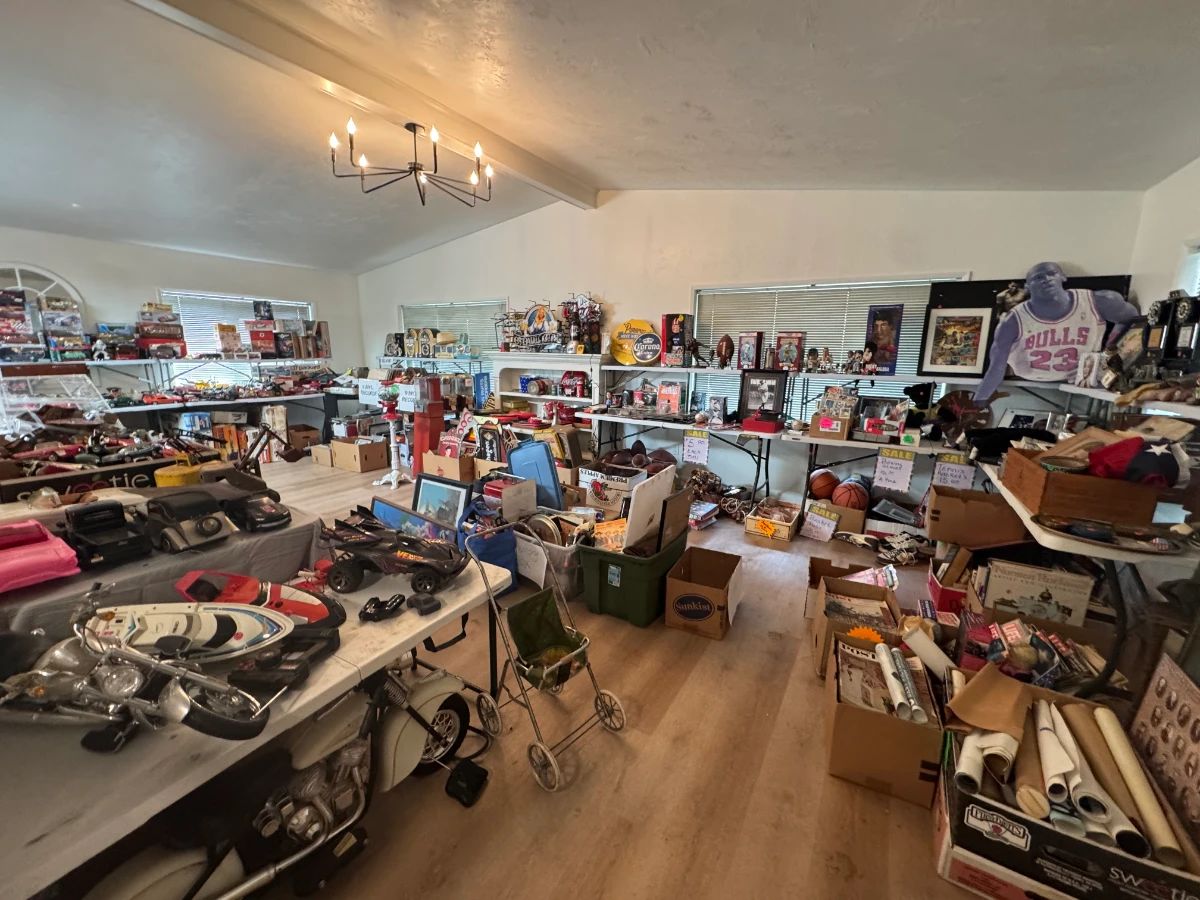 Packed picker’s antique sale room loaded with vintage collectibles, sports memorabilia, signs, toys, framed art, decor, and boxes of undiscovered treasures. Tables and shelves are full throughout the house with something in every corner—great mix for collectors, resellers, and treasure hunters.