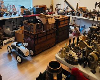 Antique and vintage room filled with trunks, metalware, bells, nautical ship models, old tools, cast iron, collectible decor, and unusual picker finds. Includes wooden chests, pedal car, primitives, and mixed industrial and farmhouse pieces for collectors, decorators, and resellers.