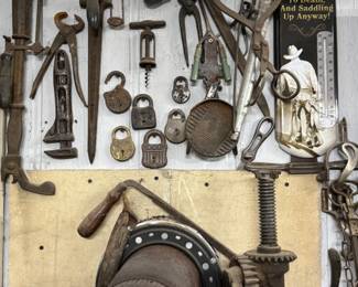 Wall display of antique hand tools and primitives including clamps, locks, rasps, presses, iron hardware, and rustic farm implements. Great assortment of vintage tool room pieces, industrial decor, and collectible workshop smalls for antique buyers, restorers, and pickers.