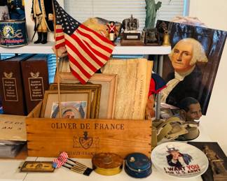 Americana and patriotic collectibles display featuring George Washington items, U.S. flag, historical decor, Statue of Liberty, Lincoln memorabilia, framed prints, political/presidential pieces, and vintage patriotic smalls. Great assortment for Americana collectors, history enthusiasts, decorators, and resellers.