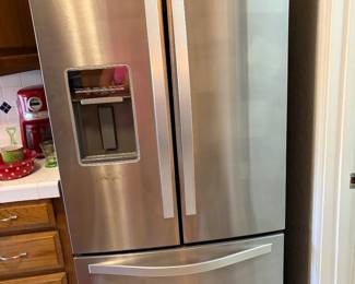 The Whirlpool WRF560SEYM05 is a 30-inch wide, 19.7 cu. ft. French door bottom-freezer refrigerator, often in white, black, or stainless steel. It features an internal ice maker and an external water dispenser. This model is designed for narrower, older kitchen spaces, though it is deeper than standard