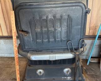 Solid Cast iron wood burning stove.