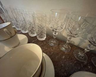 antique three-drawer dresser with marble top & cut glass wine glasses and tall tumblers
