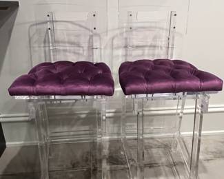 pair of lucite swivel stools. 44H x 24W x 19D