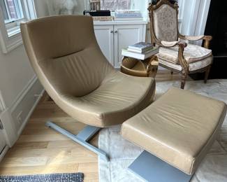 leather swivel chair and ottoman. chair measures 28-1/2W x 31D x 37H; ottoman measures 28-1/2Wx 17-1/2D x 14-1/2H