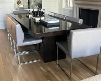 dining table and 8 leather chairs. table measures 102 x 44 x 30H