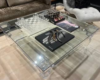 glass coffee table with acrylic legs. measures 48x48x 18-1/2"H