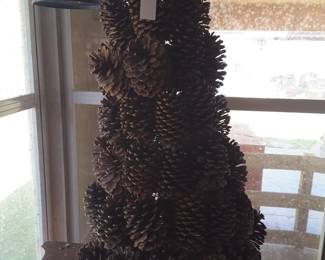 This is a pine cone tree... it's approximately 18 or 20 in tall. Would be really cool with Christmas greenery tucked in it!