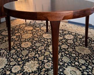 Mid-Century Modern Rosewood Extension Dining Table Likely Danish. Measures 48" D with Two 20" Leaves. Comes with Pads. Photo 1 of 4. 