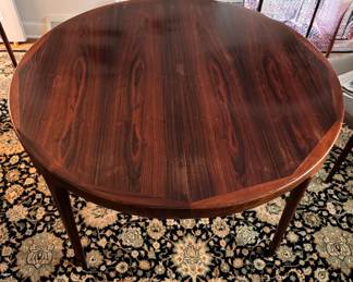 Mid-Century Modern Rosewood Extension Dining Table Likely Danish. Measures 48" D with Two 20" Leaves. Comes with Pads. Photo 2 of 4.  