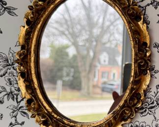 Small Oval Gilt Wood Mirror. Measures 7" W x 9" H. 